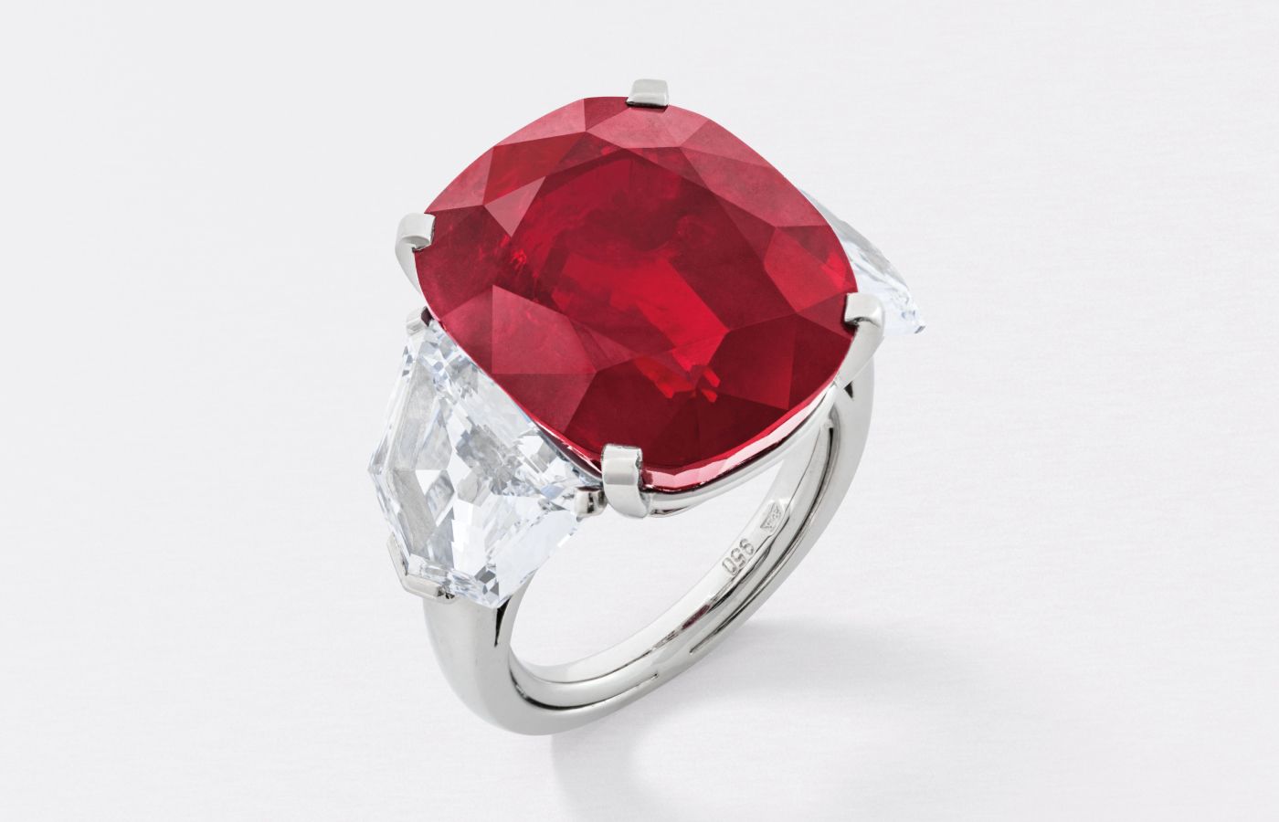 The Sunrise Ruby ring by Cartier with a cushion-shaped brilliant-cut ruby of 25.59 carats, shield-shaped diamonds of 2.70 and 2.47 carats in platinum (Lot 96) – Included in the Christie’s The World of Heidi Horten: Magnificent Jewels Part I auction