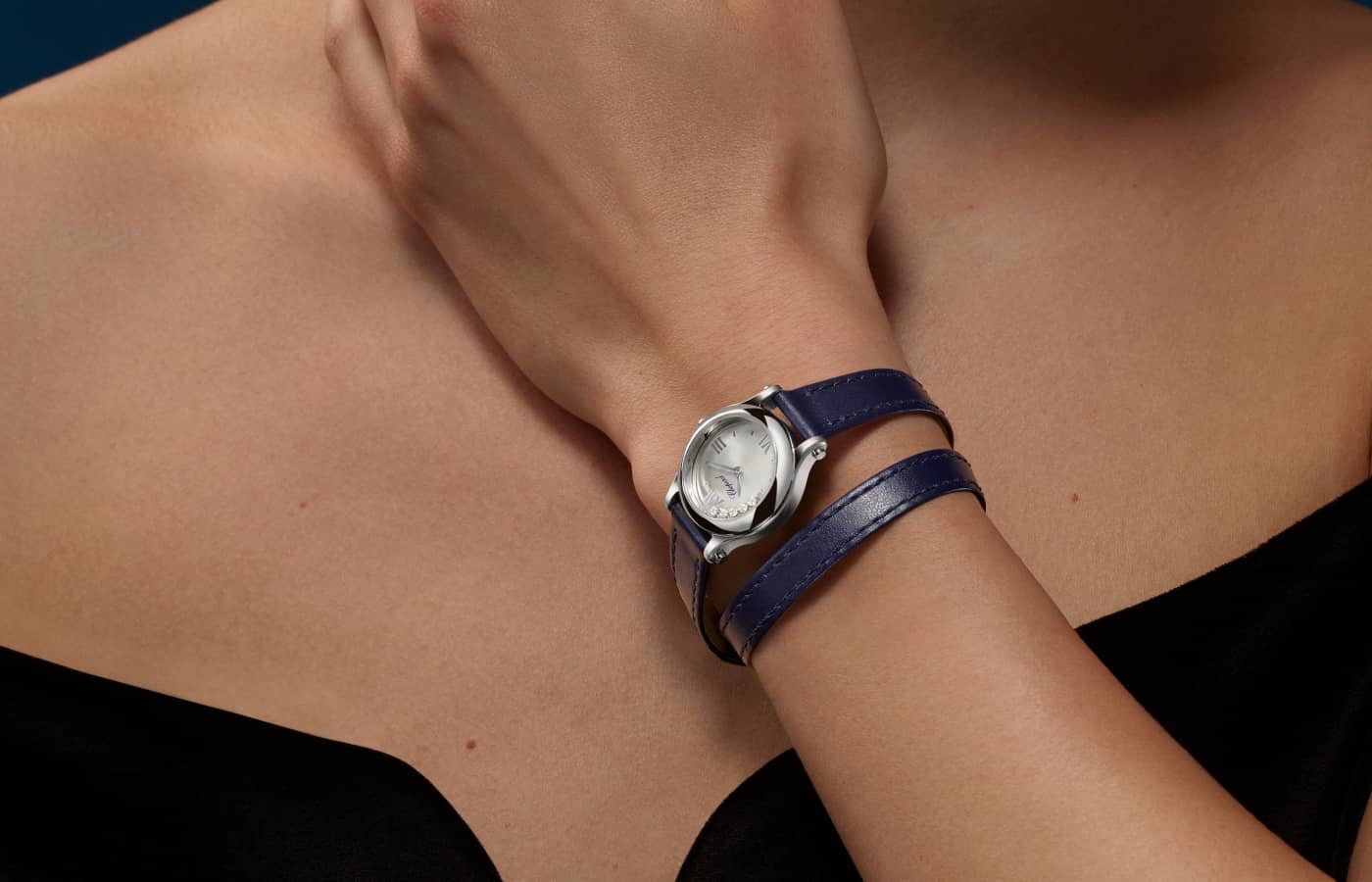  Model wearing Chopard Happy Sport watch in Lucent Steel Lucent Steel with double tour midnight blue strap