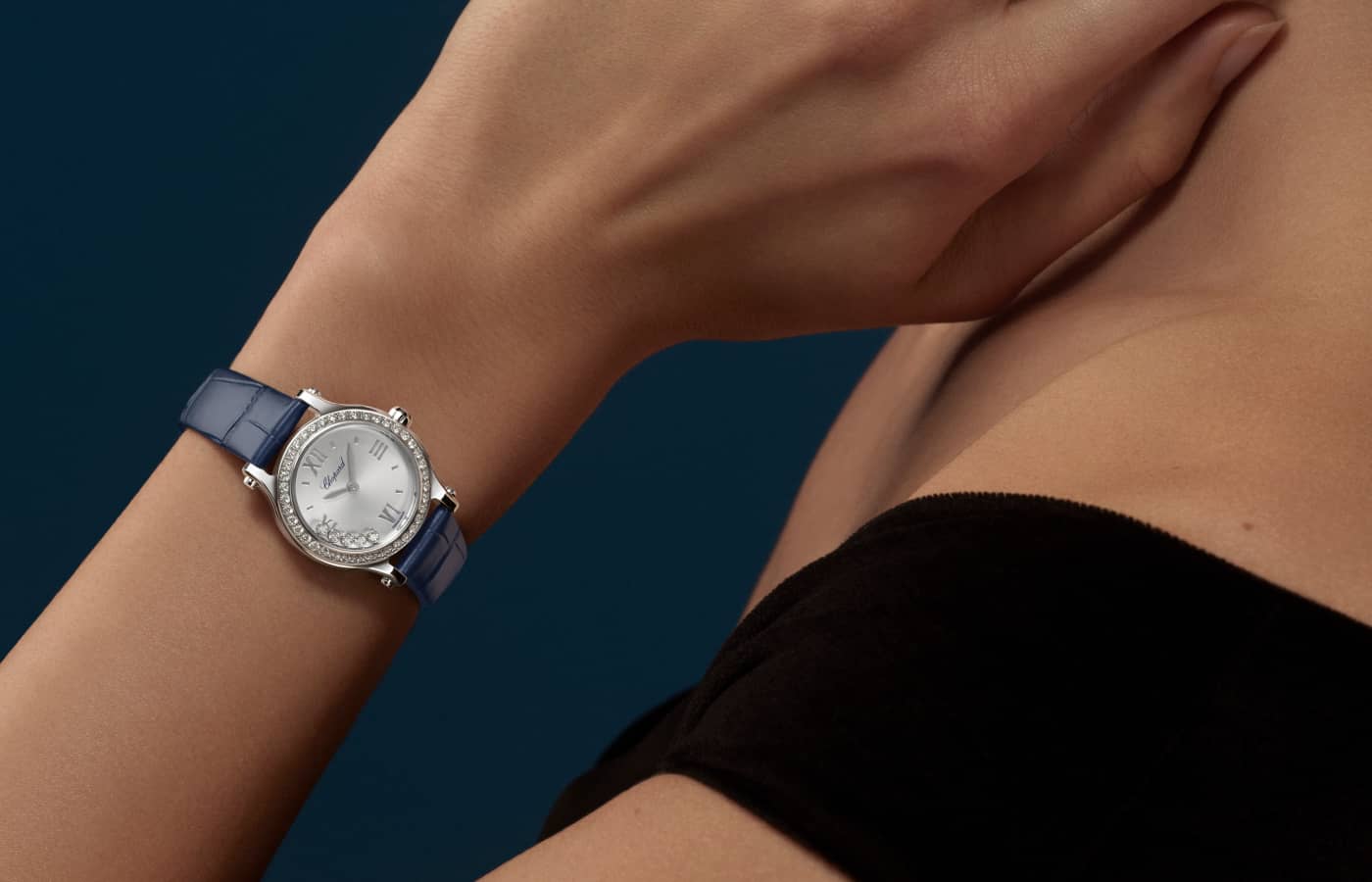 Model wearing Chopard Happy Sports watch in Lucent Steel mother of pearl and diamond 