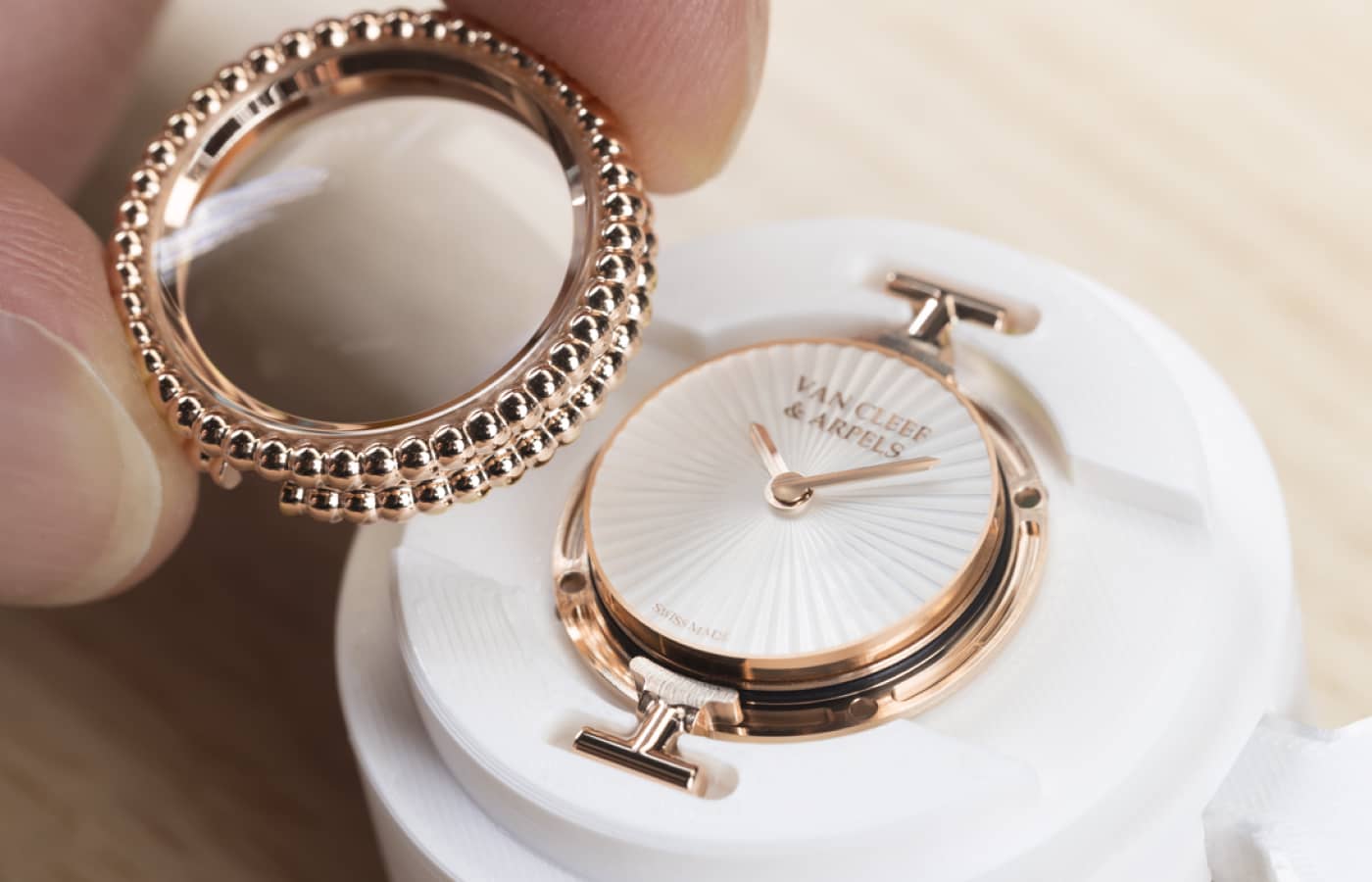  Making of the Van Cleef & Arpels Perlée watch in rose gold and guilloché white mother-of-pearl