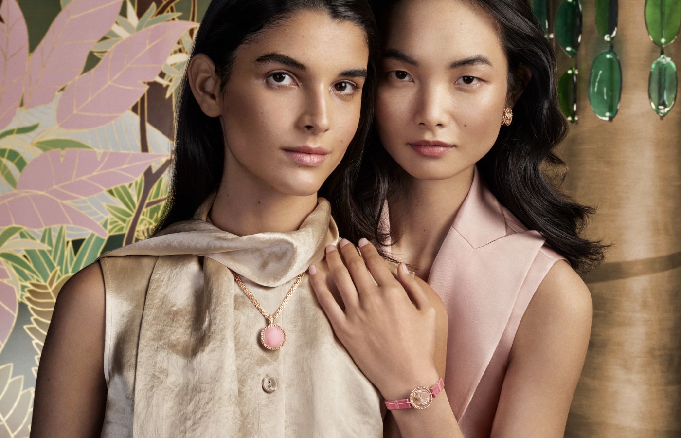 Models wearing Van Cleef & Arpels Perlée rose quartz Secret Pendant watch and Perlée watch 