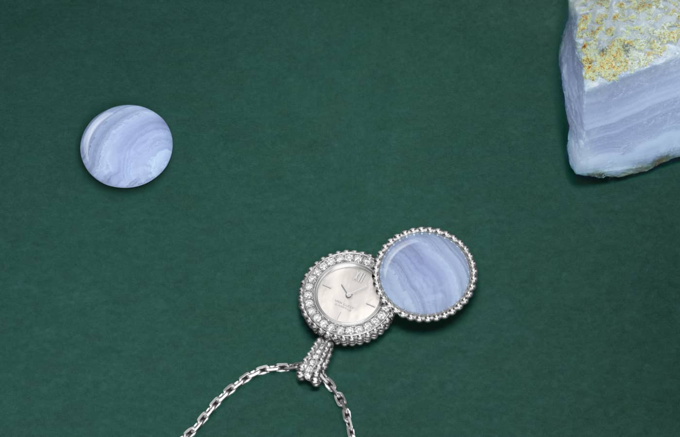 Van Cleef & Arpels Perlée Secret Pendant watch in white gold, blue chalcedony, white mother-of- pearl, diamond and Swiss quartz movement