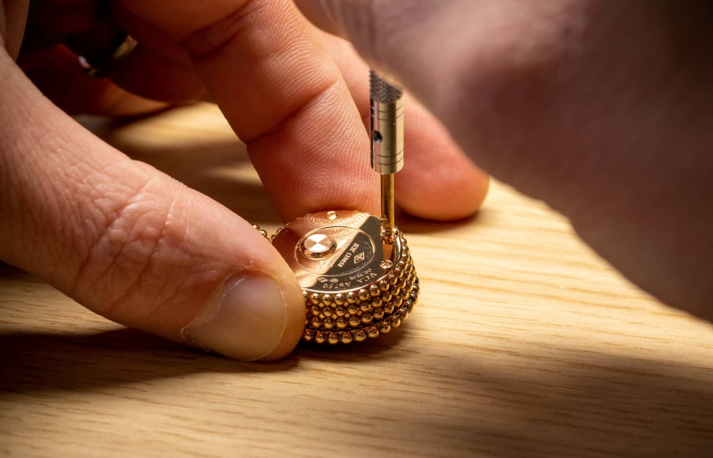  Adding the final touches to the Van Cleef & Arpels Perlée Secret Pendant watch