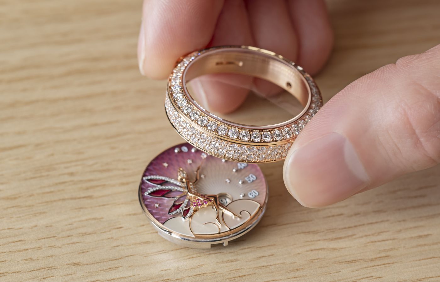  Assembling the Van Cleef & Arpels Lady Féerie Or Rose watch  in rose gold,  pink sapphire, white mother-of-pearl, opaque and plique-à-jour enamel and diamond 