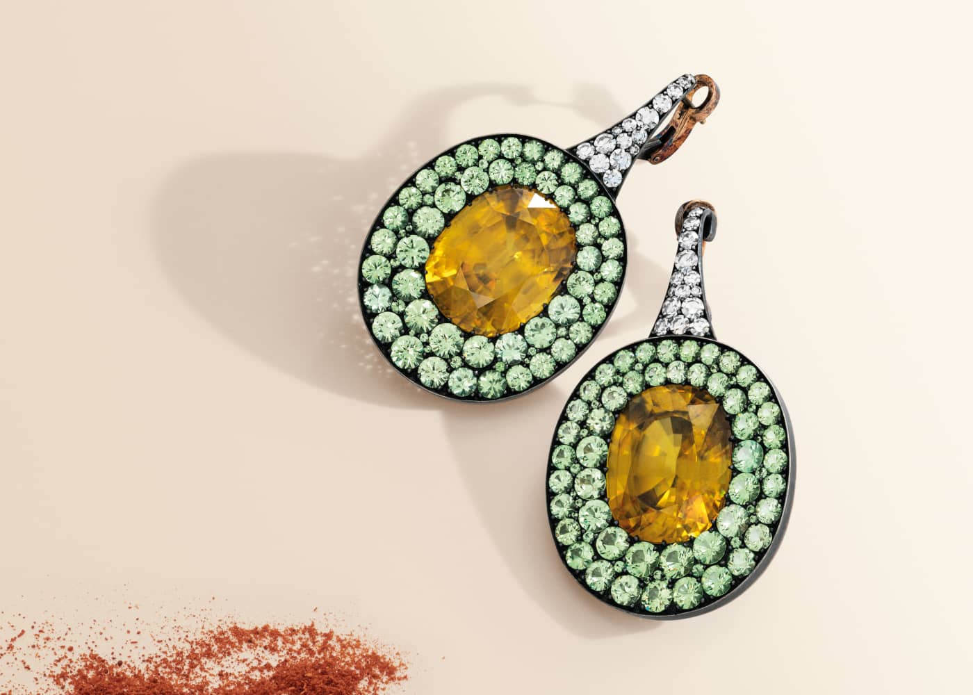 JAR earrings with oval-shaped sphenes, coloured zircon and diamond earrings in gold and silver, due to be sold at the Christie’s Magnificent Jewels auction on 17 May 2023