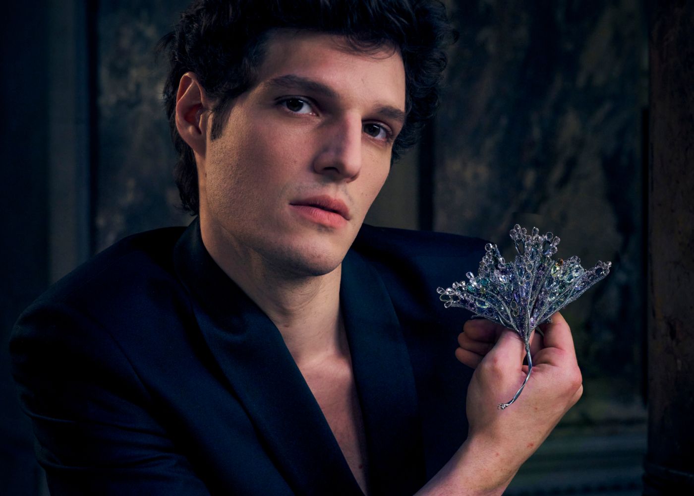  Ballet dancer Mickaël Lafon holds a brooch designed by Chinese artist jeweller Feng J. Photo credit: James Bort