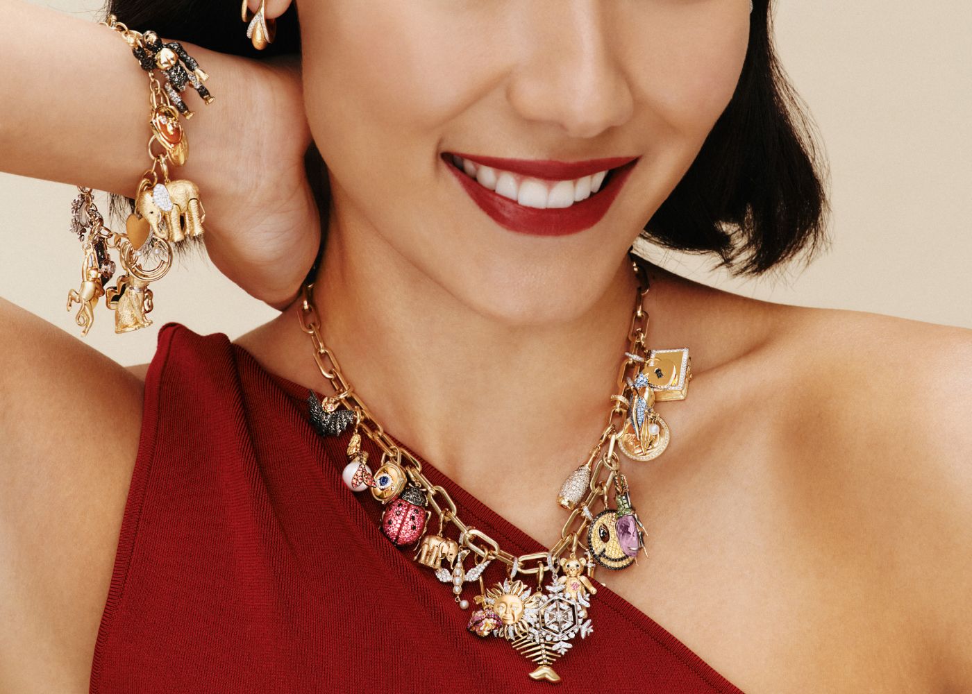 Model wearing Annoushka charm necklace and bracelet