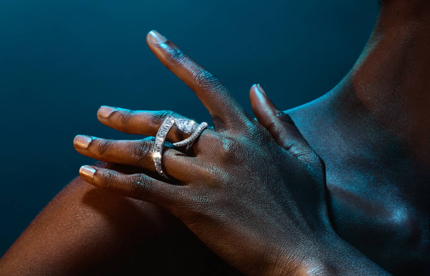 A dynamic two-finger ring with a pear-shaped diamond solitaire in the Inner Fire High Jewellery capsule collection by Bucherer Fine Jewellery