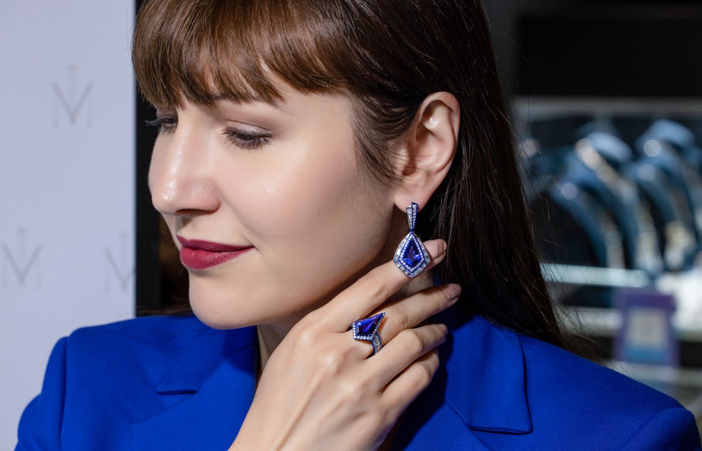  Katerina Perez wearing a Nigaam tanzanite and diamond ring with matching earrings