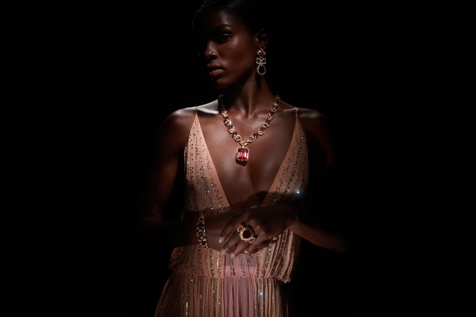 Model wearing Gucci High Jewellery necklace in gold, pink tourmaline, fancy tourmalines and diamonds from the Gucci Allegoria High Jewellery Collection