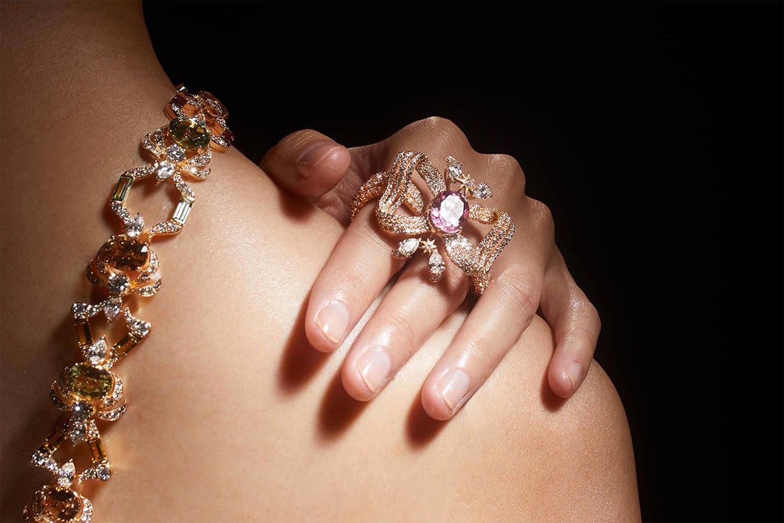  Model wearing Gucci High Jewellery multi finger ring in gold, Cuprian tourmaline and diamonds from the Gucci Allegoria High Jewellery Collection