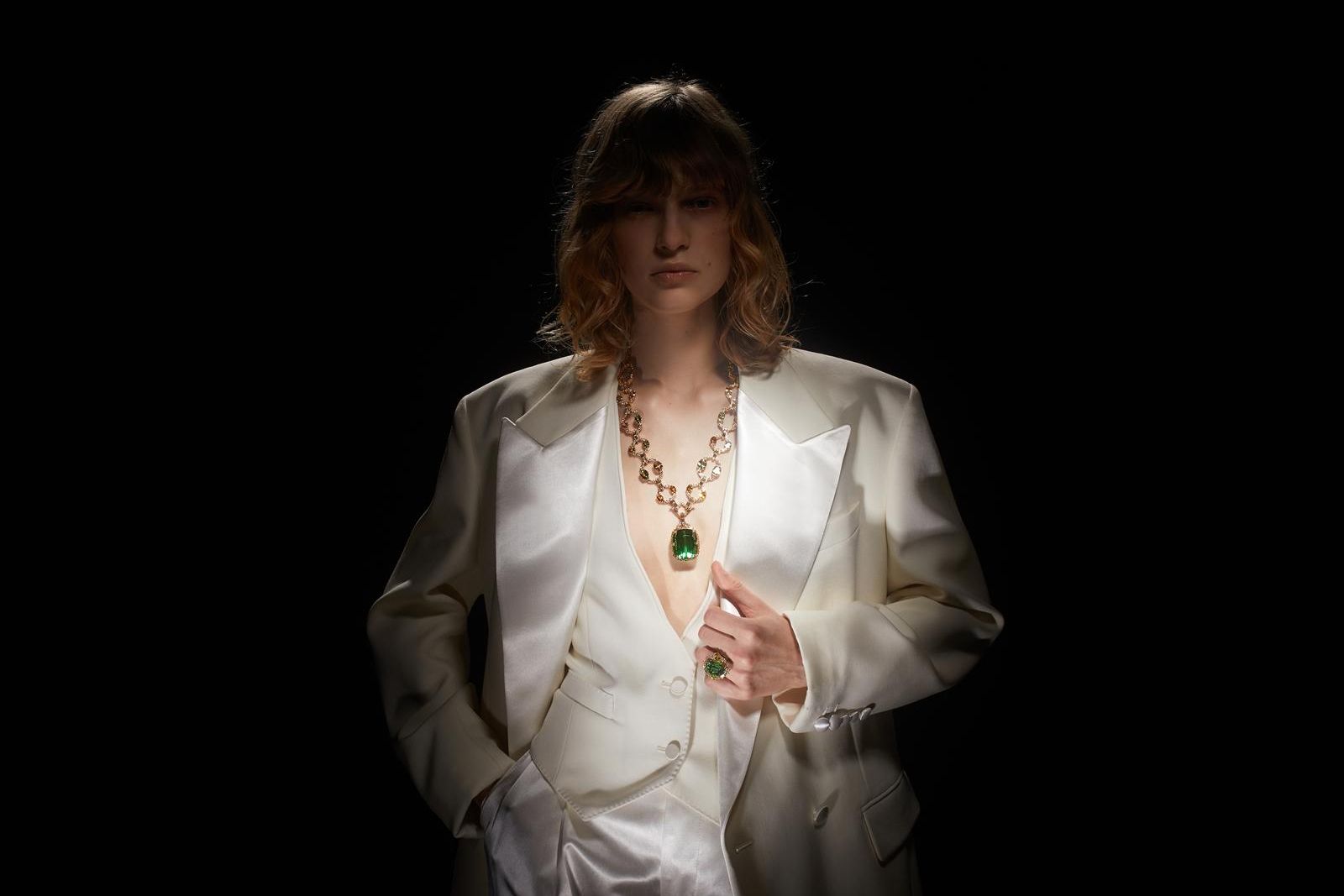  Model wearing  Gucci High Jewellery necklace in gold, green tourmaline, yellow beryls, fancy tourmalines and diamonds from the Gucci Allegoria High Jewellery Collection