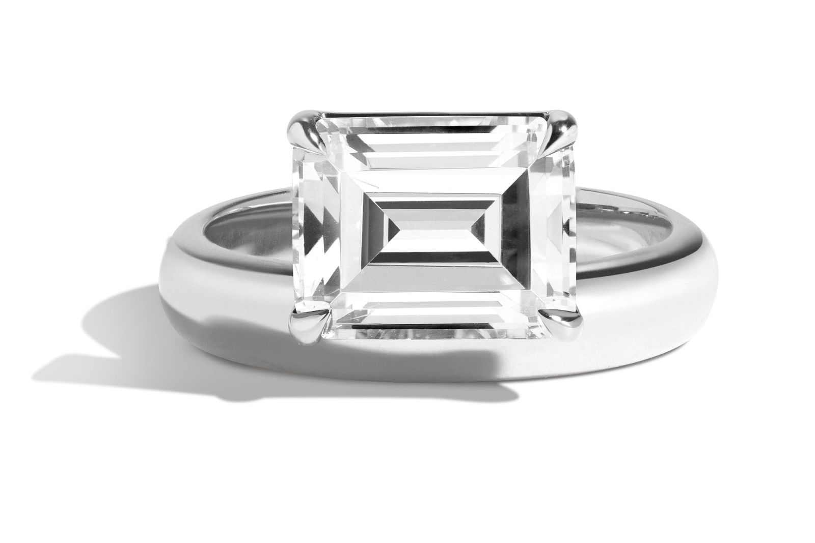  Shahla Karimi Donut ring in platinum featuring an offset emerald-cut diamond 