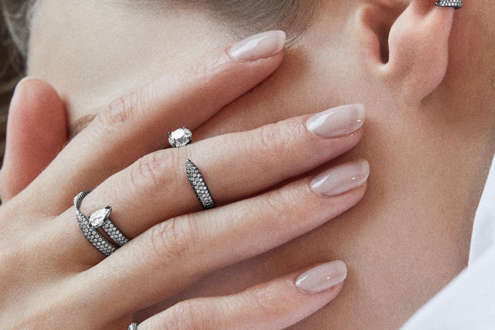  Model wearing Eva Fehren rings in blackened white gold and diamond