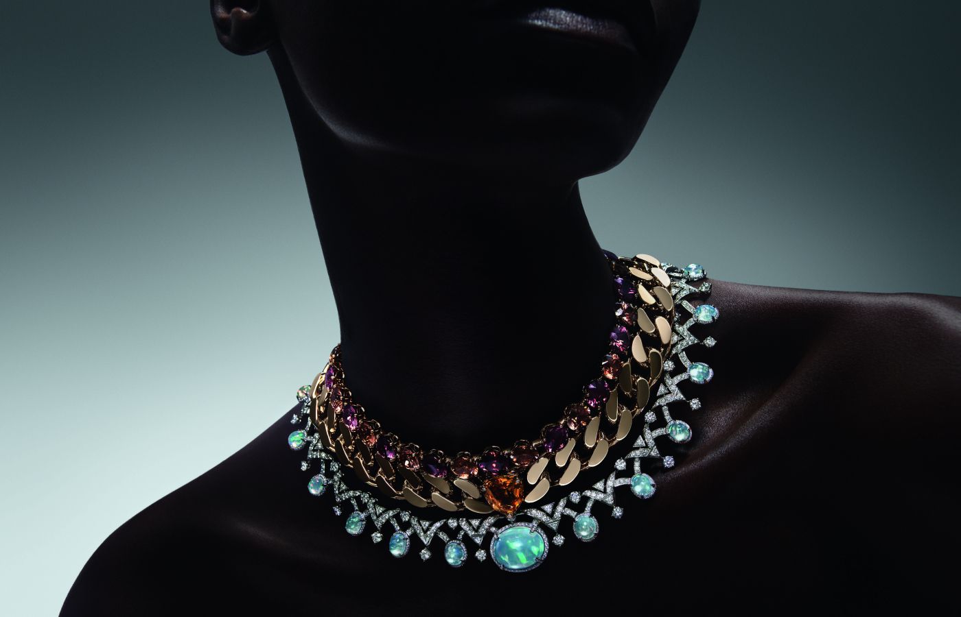  Model wearing Louis Vuitton Rupture High Jewellery transformable necklace in gold, platinum, a 15.02-ct oval-cut opal, a 13.81-ct triangle-cut yellow sapphire, 17.75-cts of oval-cut opals, zircon and diamond from the Deep Time High Jewellery Collection 