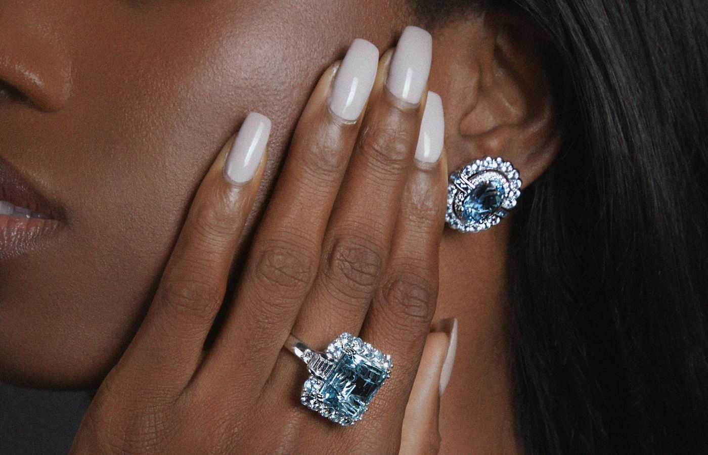 A model wears Sunita Nahata jewels from The Blue Lagoon collection set with deep blue Santa Maria aquamarines and diamonds in 18k white gold