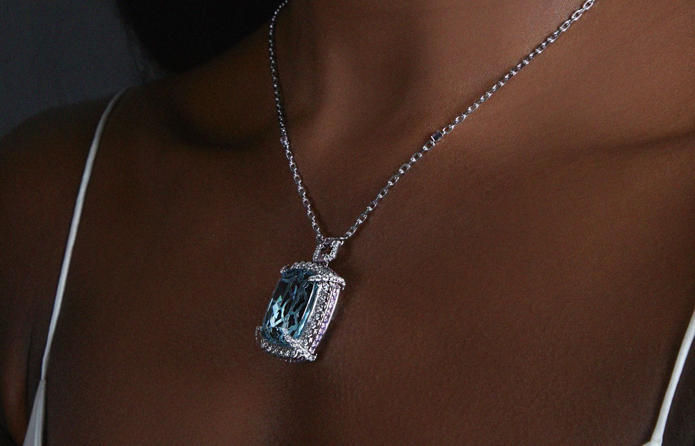  Sunita Nahata Icy Blue aquamarine necklace set against a frame of pink sapphires 
