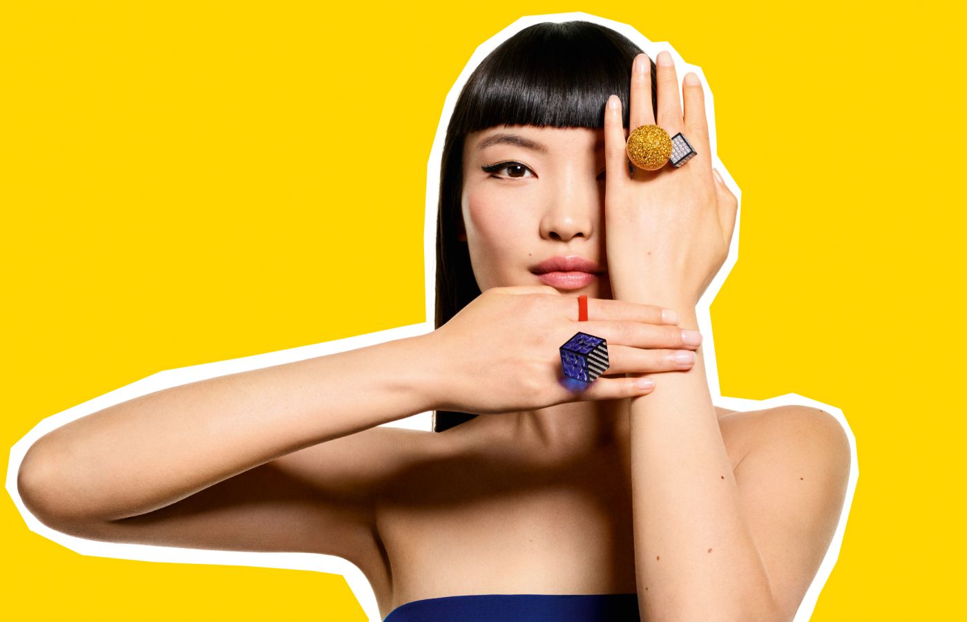 A model wears Boucheron This Is Not A Ring creations, including a ring with Murano glass, diamonds and decorated with lacquer and resin in titanium and white gold, from the More is More High Jewellery collection