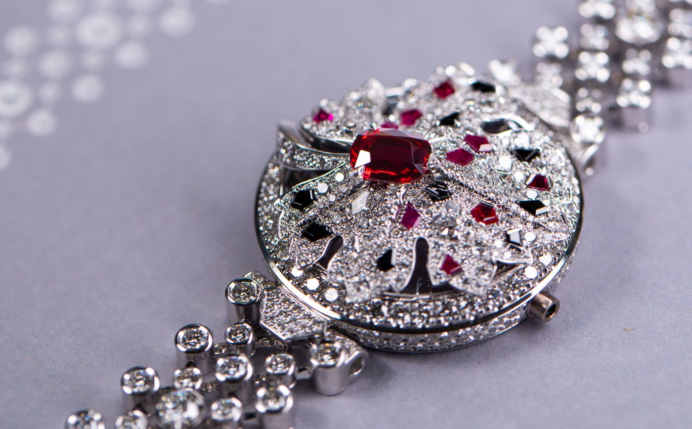 Chaumet Feuille de Vigne secret watch in white gold, ruby, grey and black spinels and diamond from Le Jardin de Chaumet High Jewellery collection 