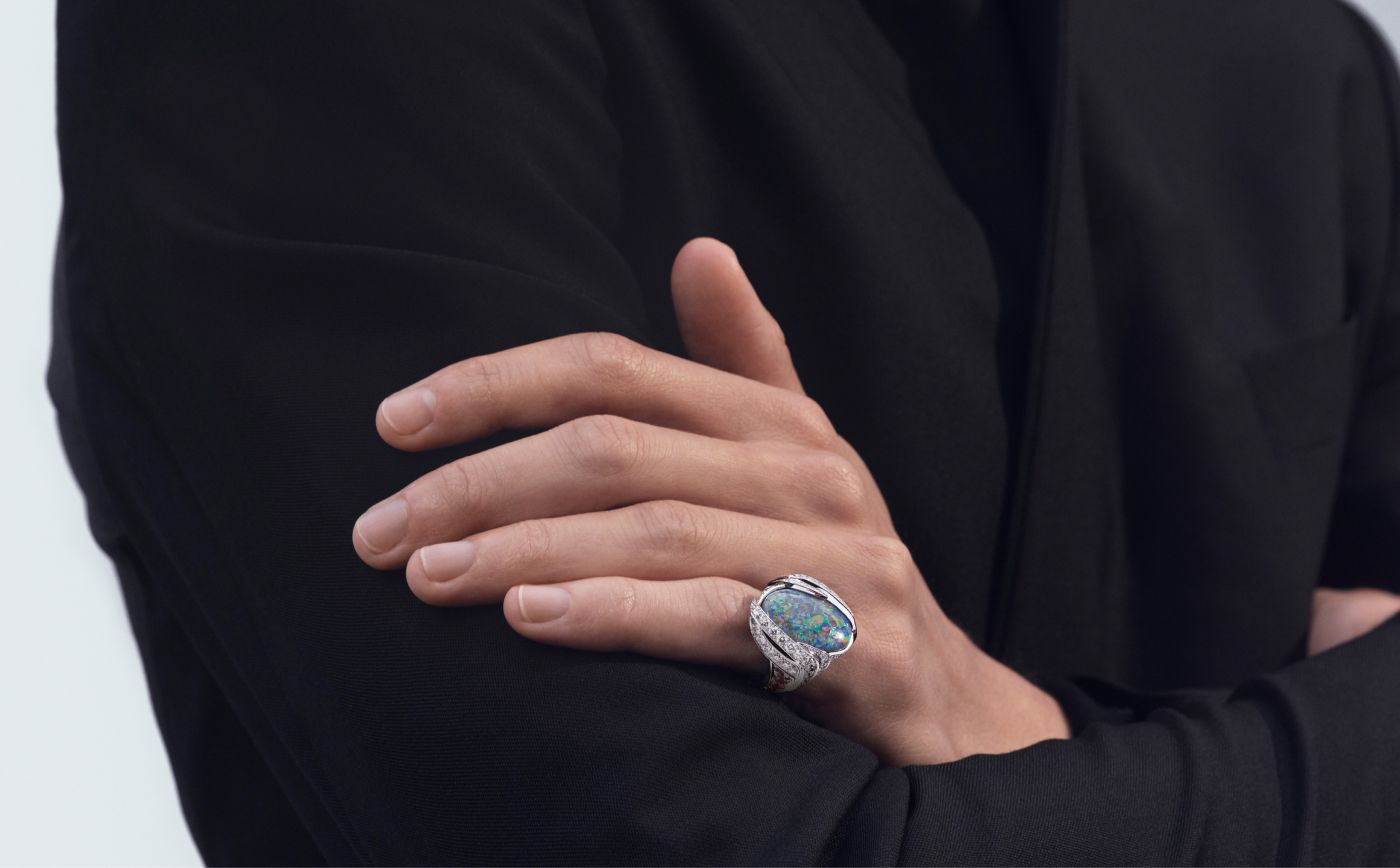 Model wearing Chaumet Gui ring in white gold, platinum, a 10-ct emerald and diamond from Le Jardin de Chaumet High Jewellery collection