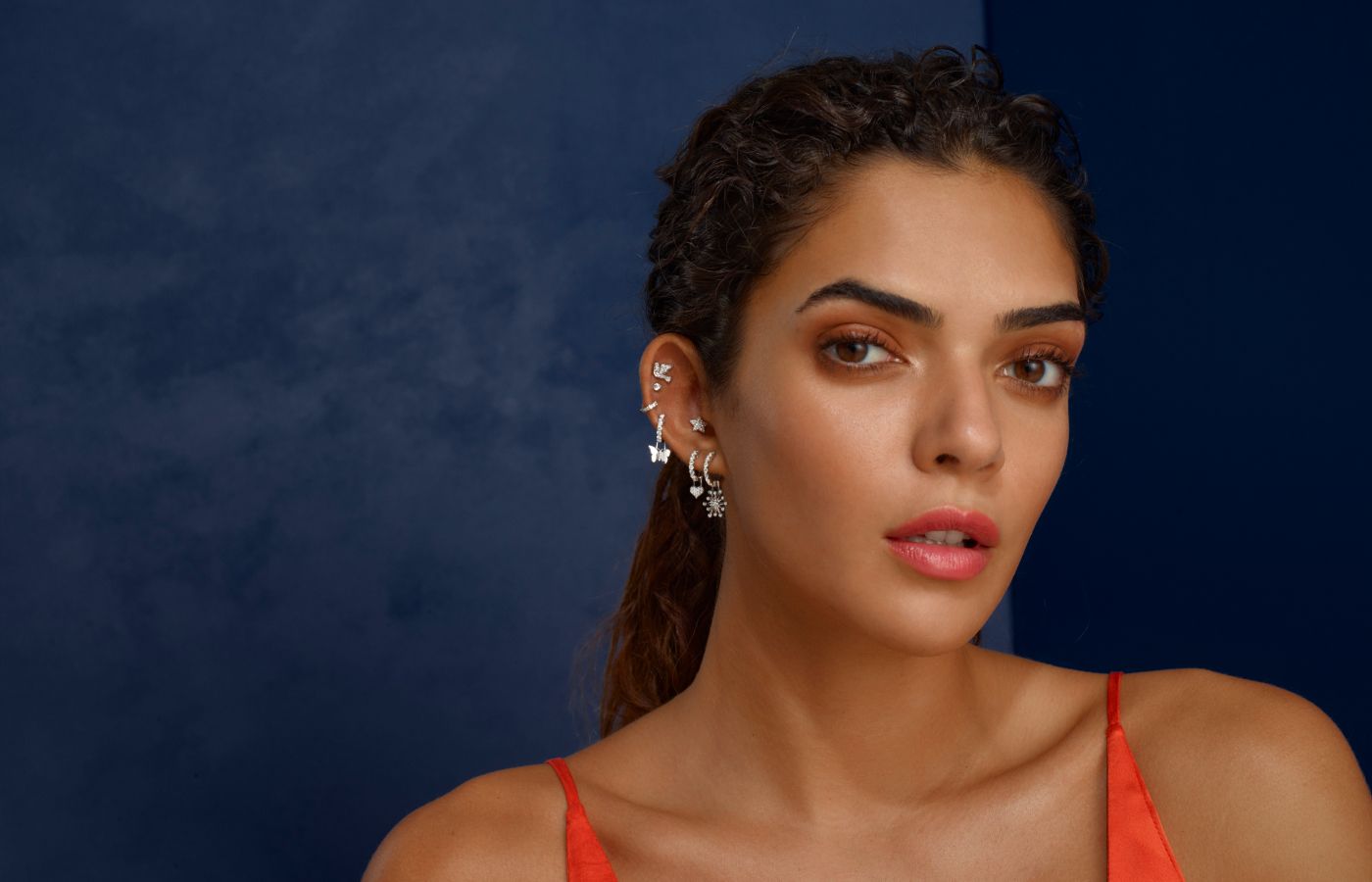  A model wears diamond-set creations from the Robinson Pelham EarMenu