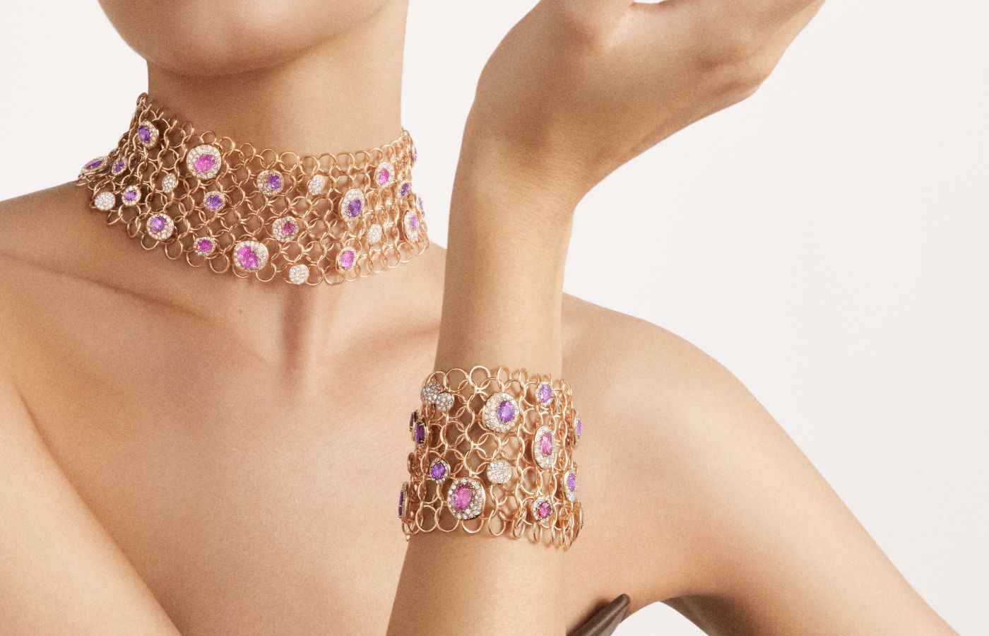  Model wearing Pomellato Urban Bloom necklace and bracelet in  rose gold, pink and purple sapphires, and diamonds from the Ode to Milan High Jewellery collection