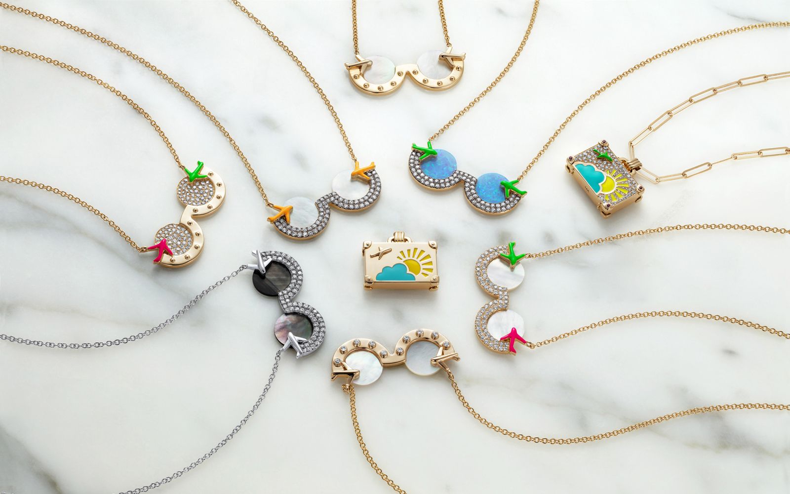 NeverNoT necklaces in gold, white gold, mother of pearl, enamel, opal and diamond from the Travel collection