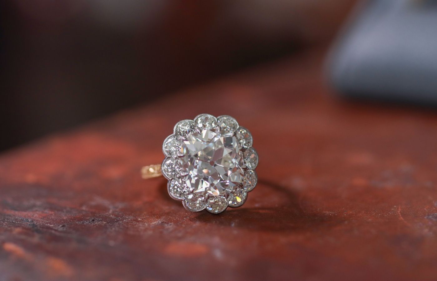 Hancocks Cluster ring featuring a 5.08-ct old mine cushion diamond