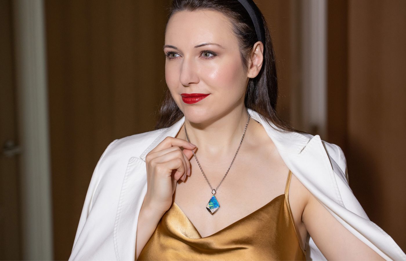Katerina Perez wears an Australian opal and diamond necklace by Cindy Xu 