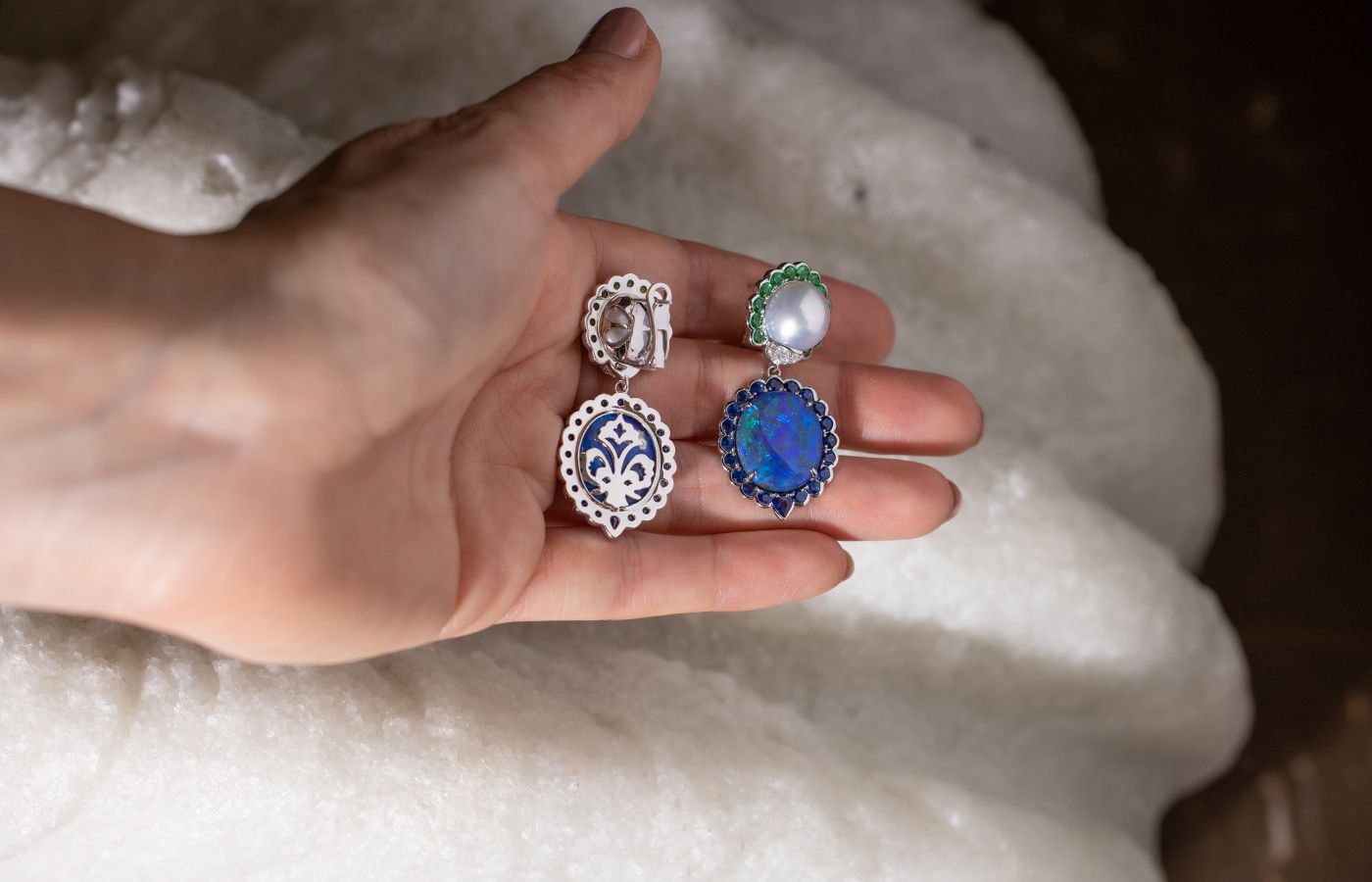 Details on the front and back of a pair of Cindy Xu black opal and South Sea pearl drop earrings with tsavorites and sapphires in 18k white gold 