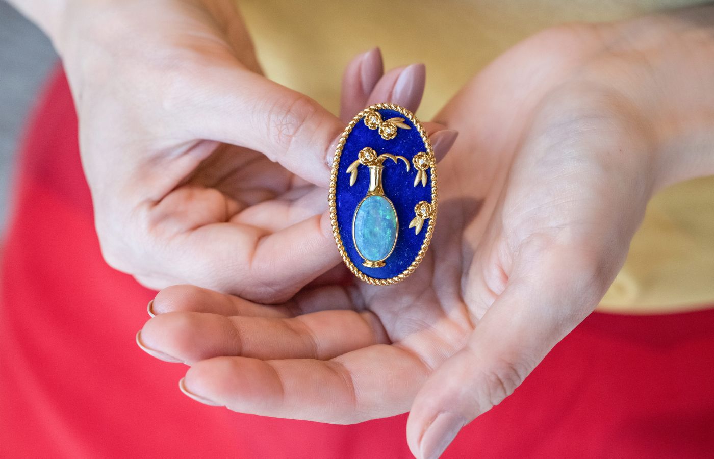 This Chinese vase-inspired brooch by Cindy Xu is one in a series of three antique-style pieces, set with black opal, lapis lazuli and diamonds in 18k gold 