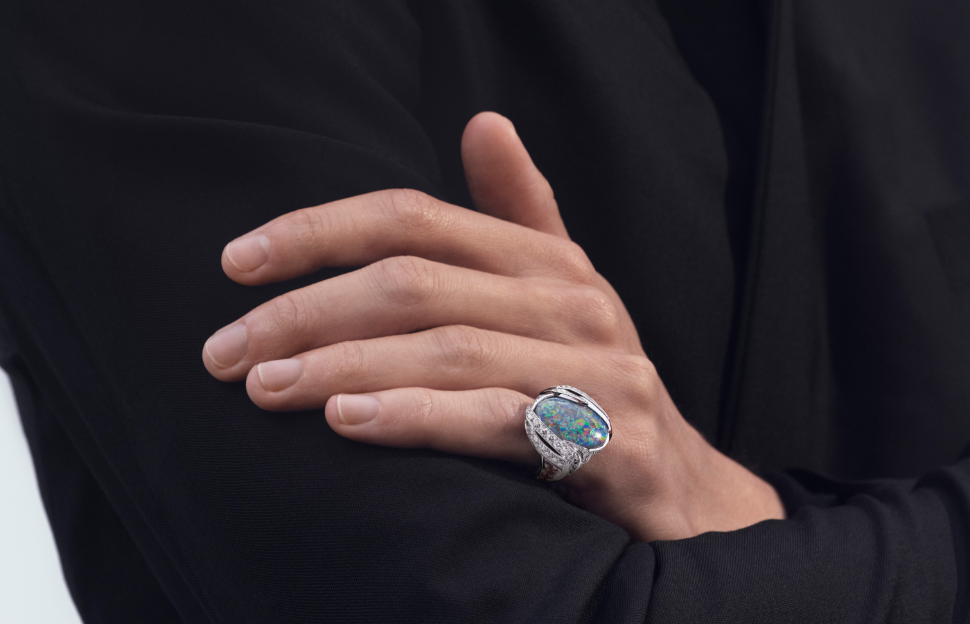 Model wearing Chaumet Ecorce high jewellery ring in white gold and diamond, featuring a 10.13-ct black opal from Le Jardin de Chaumet collection