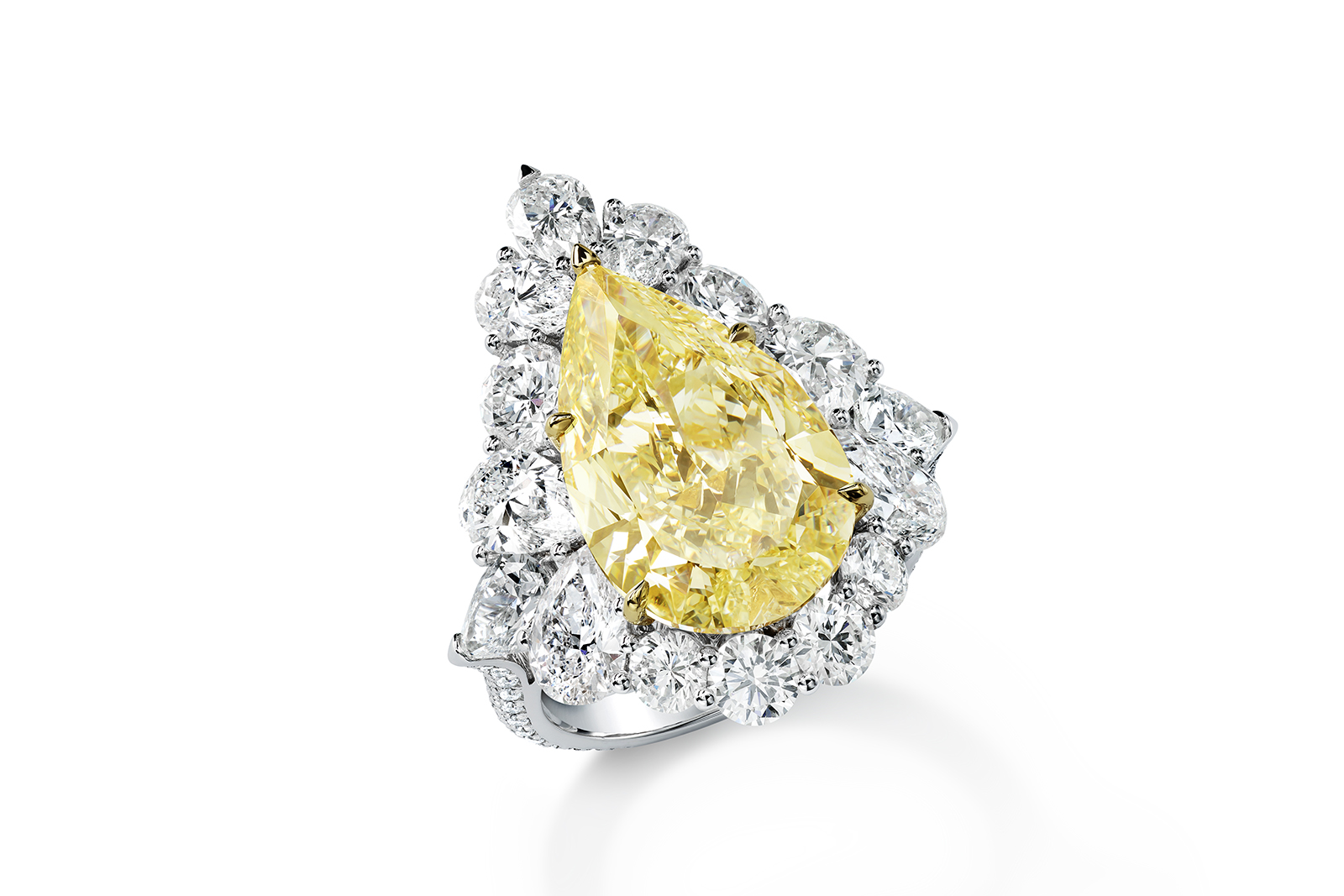  Chopard ring from The Red Carpet collection featuring one pear-shaped fancy yellow diamond of 7.99 carats, pear-shaped white diamonds for a total of 3.55 carats, and further brilliant-cut diamonds set in 18k yellow and white gold         