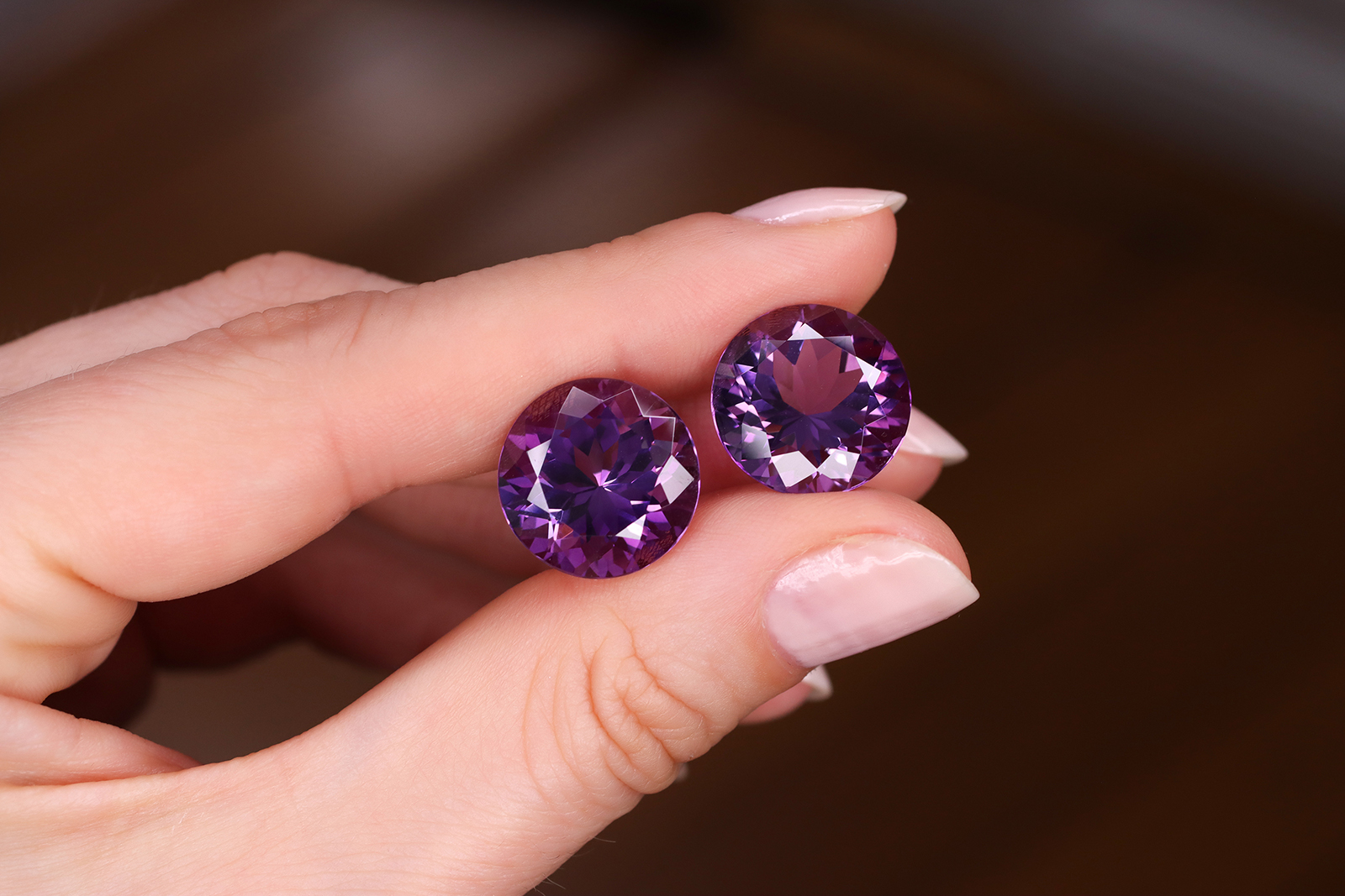  Gemhype.com round-cut Brazilian amethyst pair with a total weight of 10.78 carats, eye clean with no treatments
