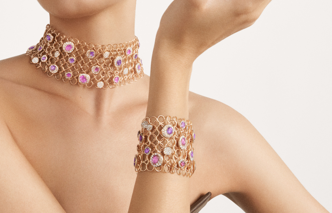  Model wearing Pomellato Urban Bloom necklace and bracelet in  rose gold, pink and purple sapphires, and diamonds from the Ode to Milan High Jewellery collection