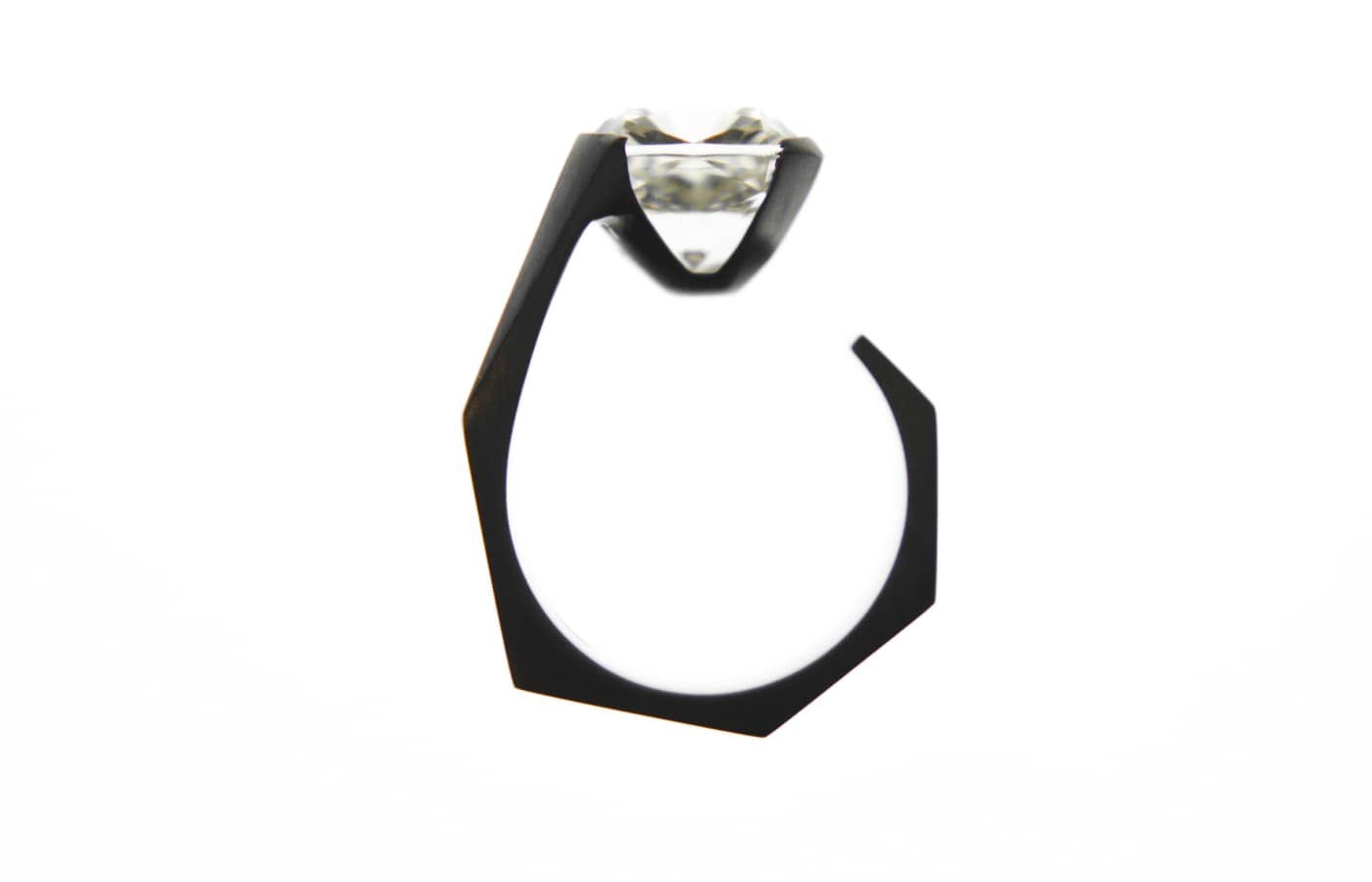  Dina Kamal Transformer Cushion ring in blackened gold featuring a cushion-cut diamond