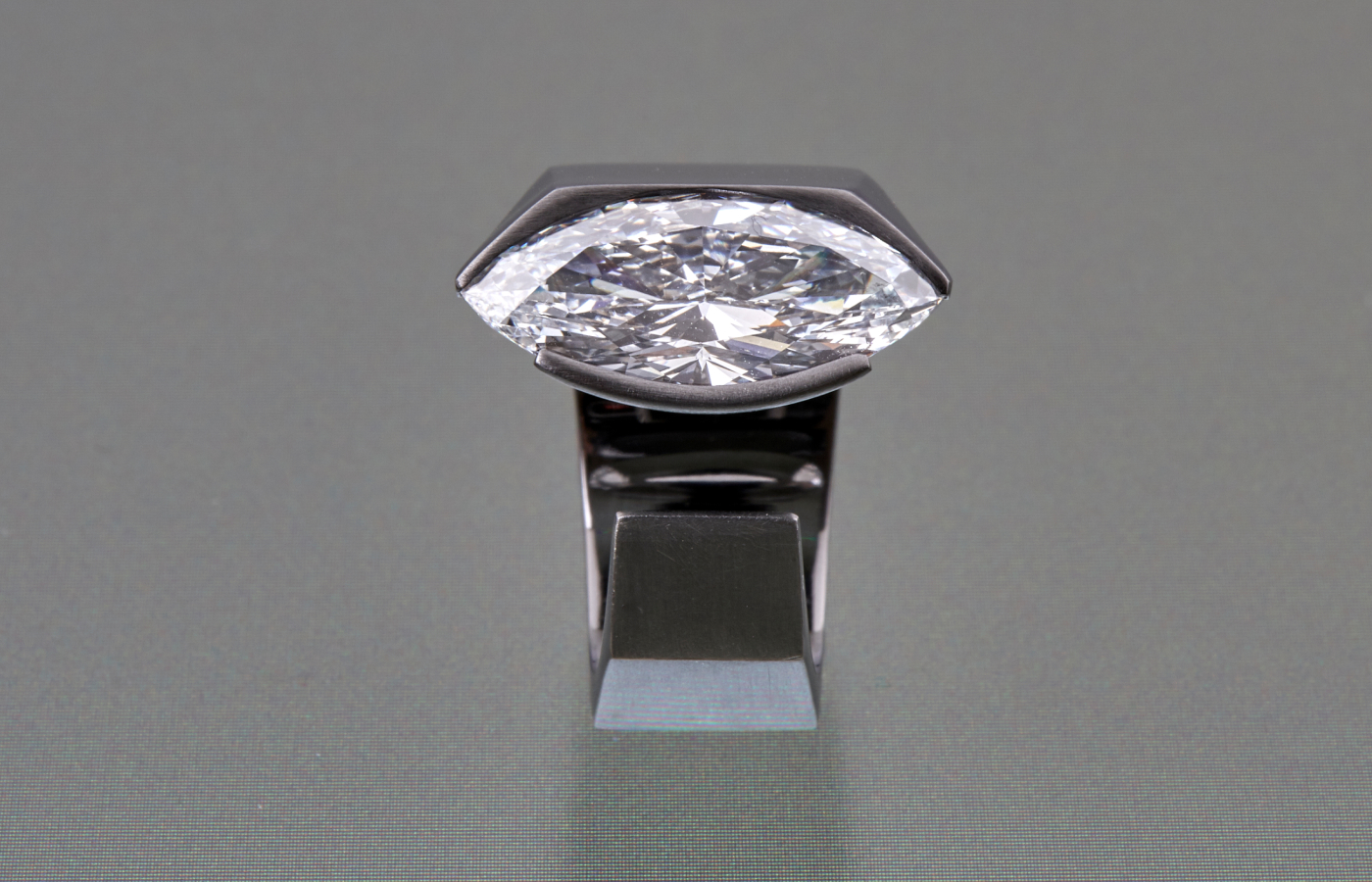  Dina Kamal Transformer Marquise ring in blackened gold featuring a Marquise-cut diamond