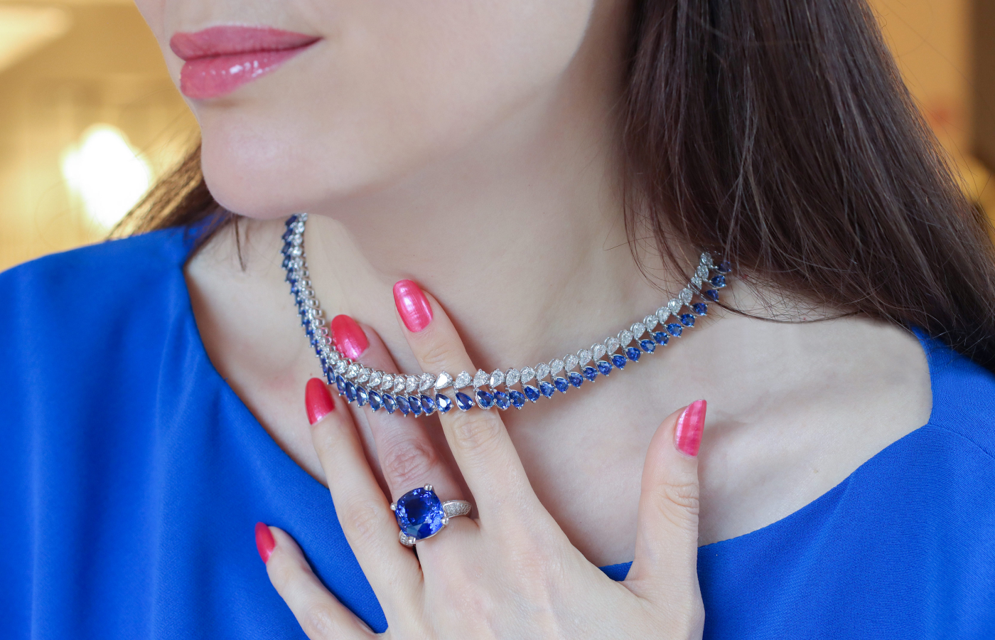 Katerina Perez wearing a selection of Bucherer Fine Jewellery diamond and sapphire necklaces and ring