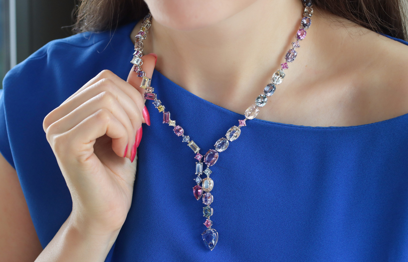 Katerina Perez wearing the Bucherer Fine Jewellery Pastello Confetti necklace in white gold, multicolour sapphires and diamonds 