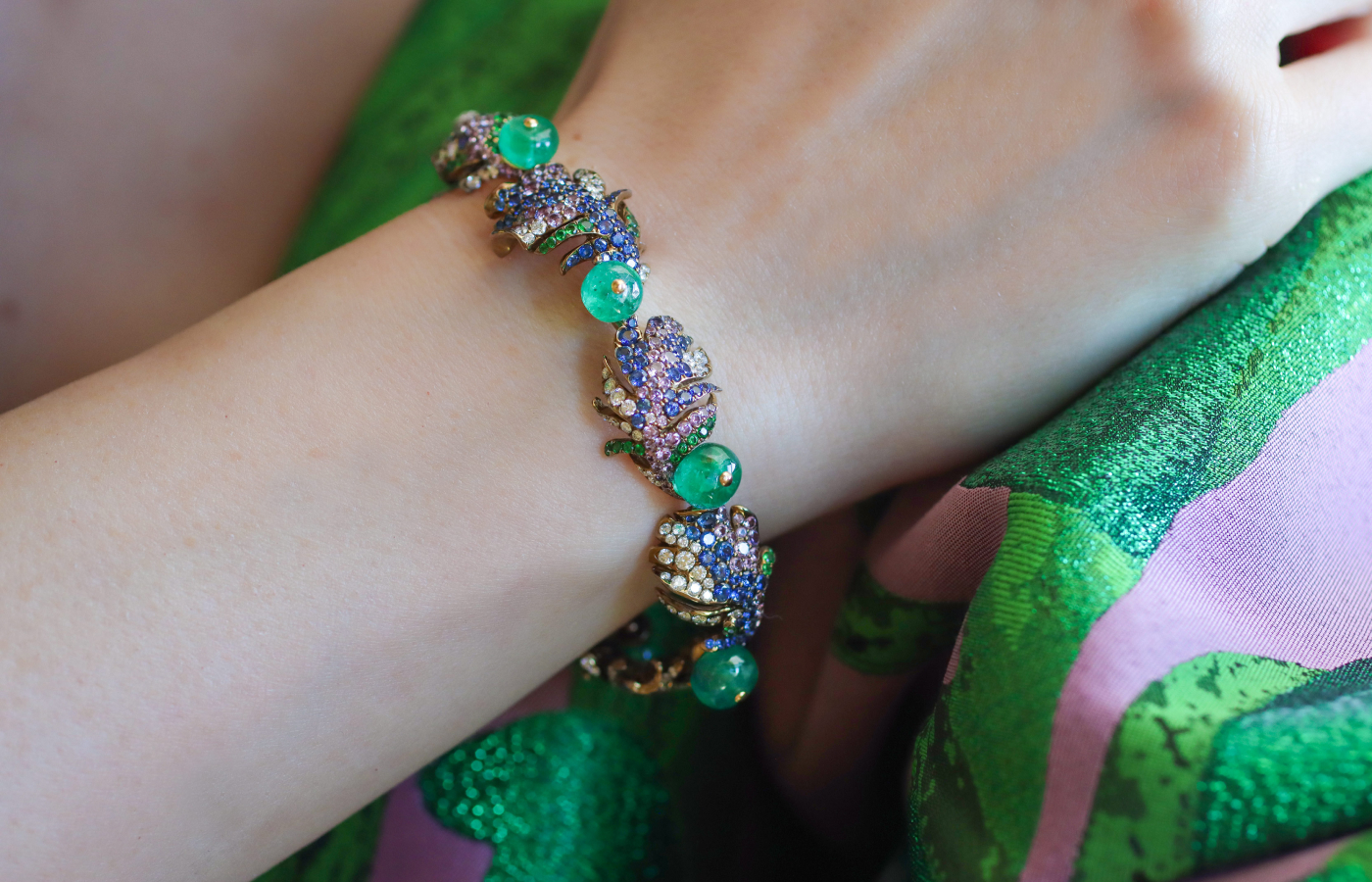  Katerina Perez wearing the Loriini earrings in emerald, multicoloured gemstones and diamond by Neha Dani