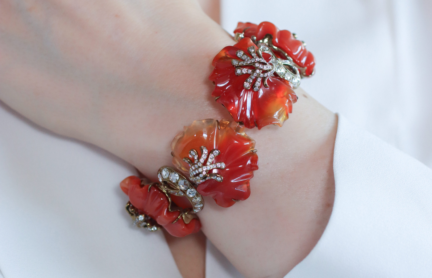  Katerina Perez wearing a bracelet in carved agate with diamonds set in titanium by Neha Dani 