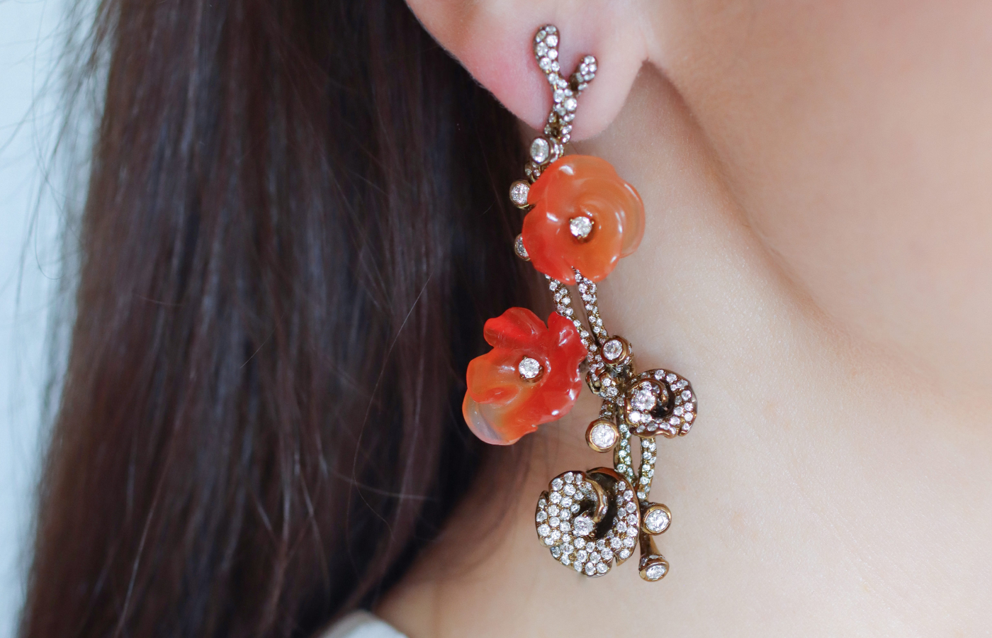 Katerina Perez wearing carved agate and diamond earrings by Neha Dani