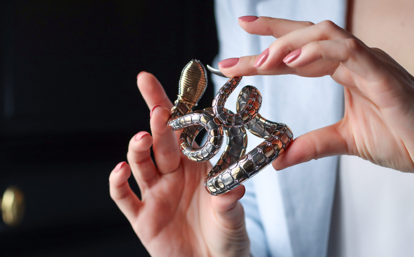  Snake cuff bracelet with a cabochon rubellite in yellow gold and silver from Magica Naturae collection by Elie Top