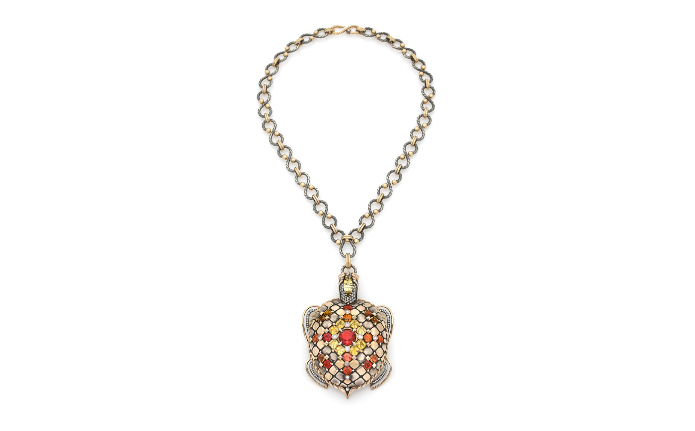  Turtle pendant with sapphires, beryls and a cushion cut spessartine garnet  by Elie Top