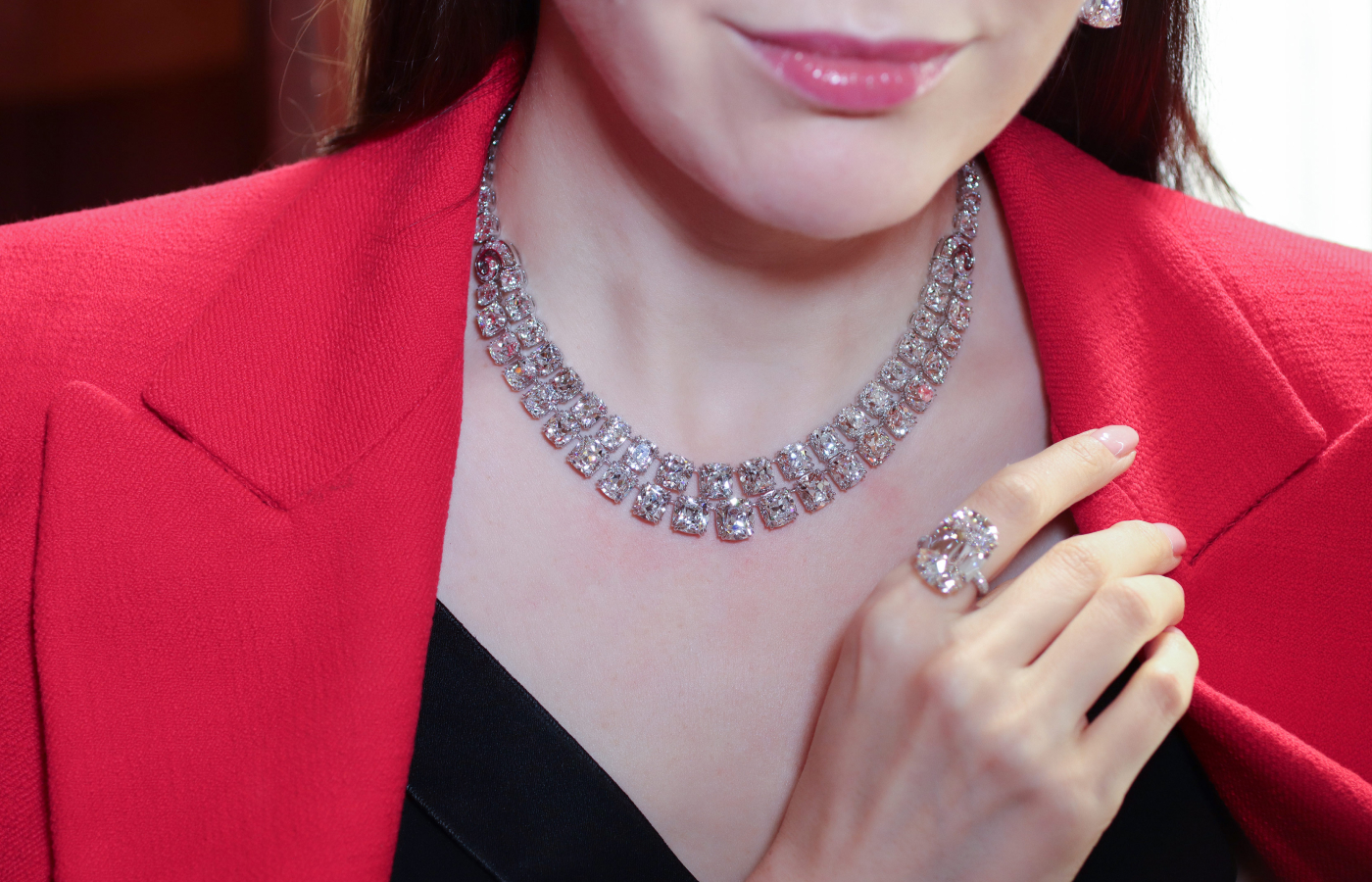 Katerina Perez wears an antique cushion-cut diamond necklace weighing 148.25 carats by Ronald Abram