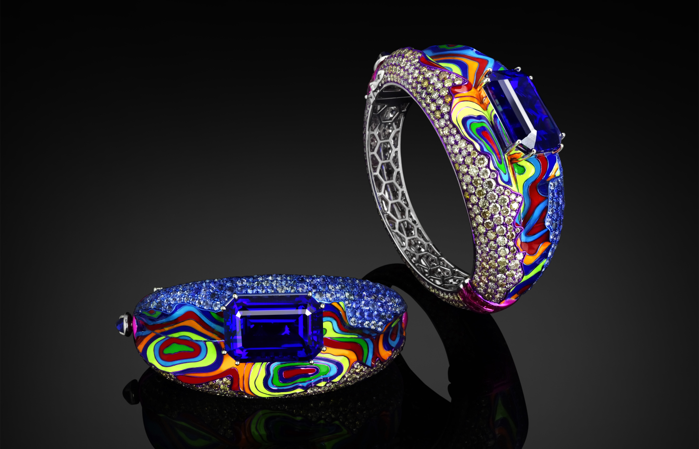 Austy Lee ‘The Hypnotic Magma Bangle’ in 18K white gold with tanzanite, Sri Lankan blue sapphire, red, orange yellow, blue, green and turquoise enamels, blue sapphires, rubies and diamonds