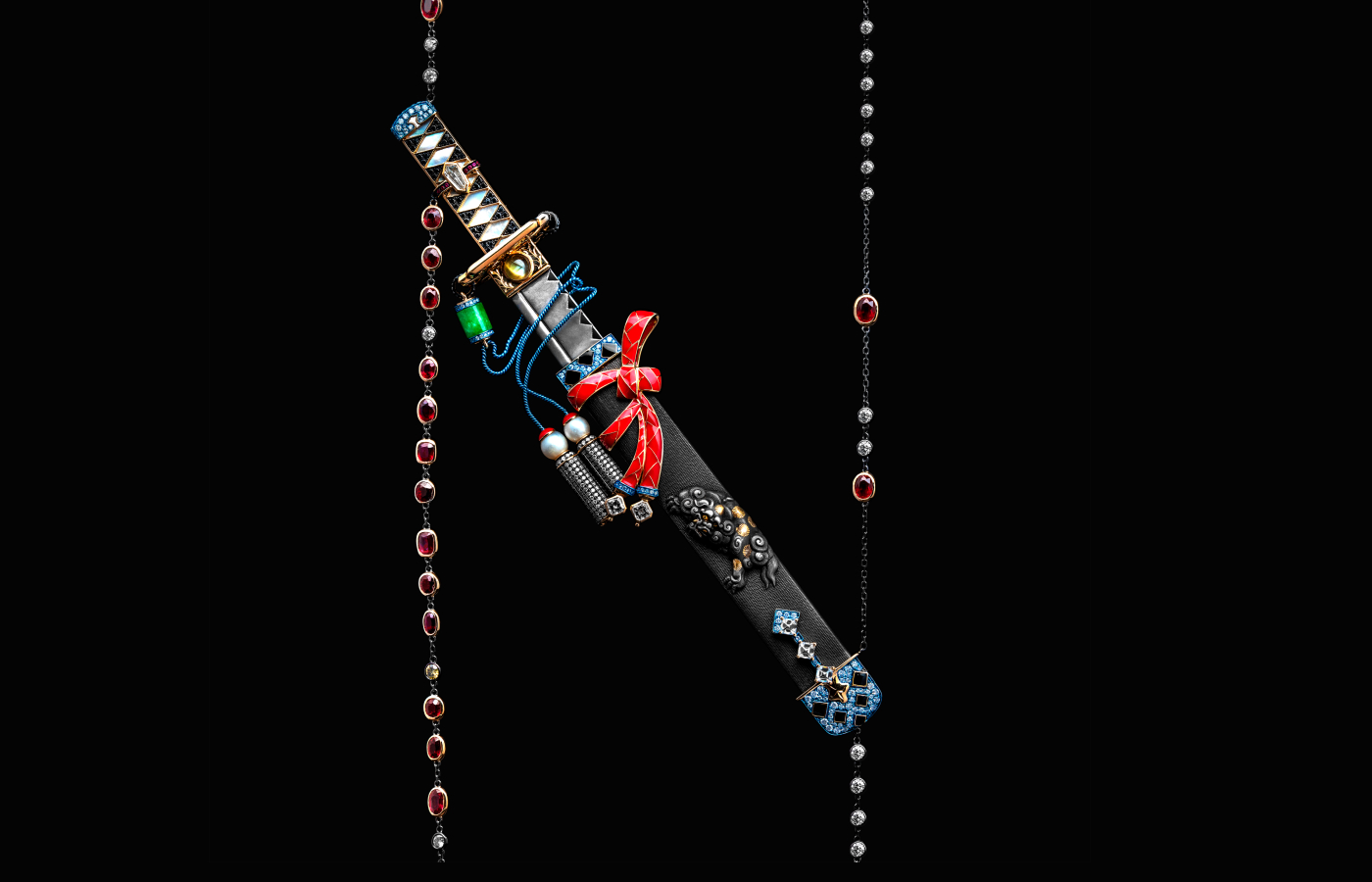 Austy Lee ‘The Burakku raion wakizashi Necklace’ in 18k yellow gold with antique Meiji Kozuka, Mozambican unheated pigeon blood rubies, mother of pearl, onyx, pearls, rubies, Burmese green jade, cat’s eye chrysoberyl, blue sapphires, red enamel and diamonds