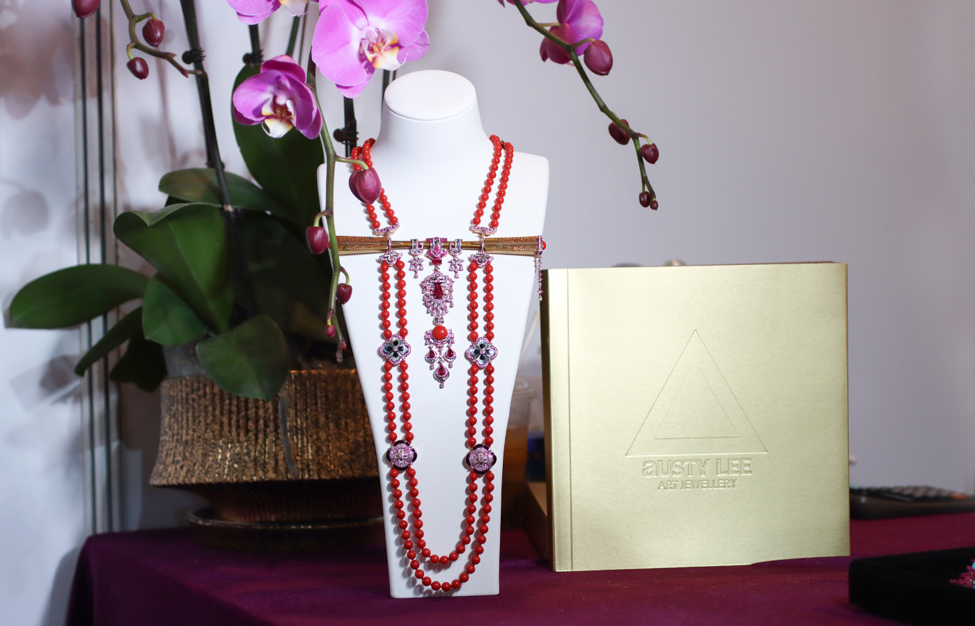 Austy Lee ‘The Akai Amorōnagu Necklace’ in 18K rose gold with Mozambican unheated pigeon-blood rubies, Momo red coral, antique Meiji maki-e lacquered hairpin, red and black enamel, and diamonds 