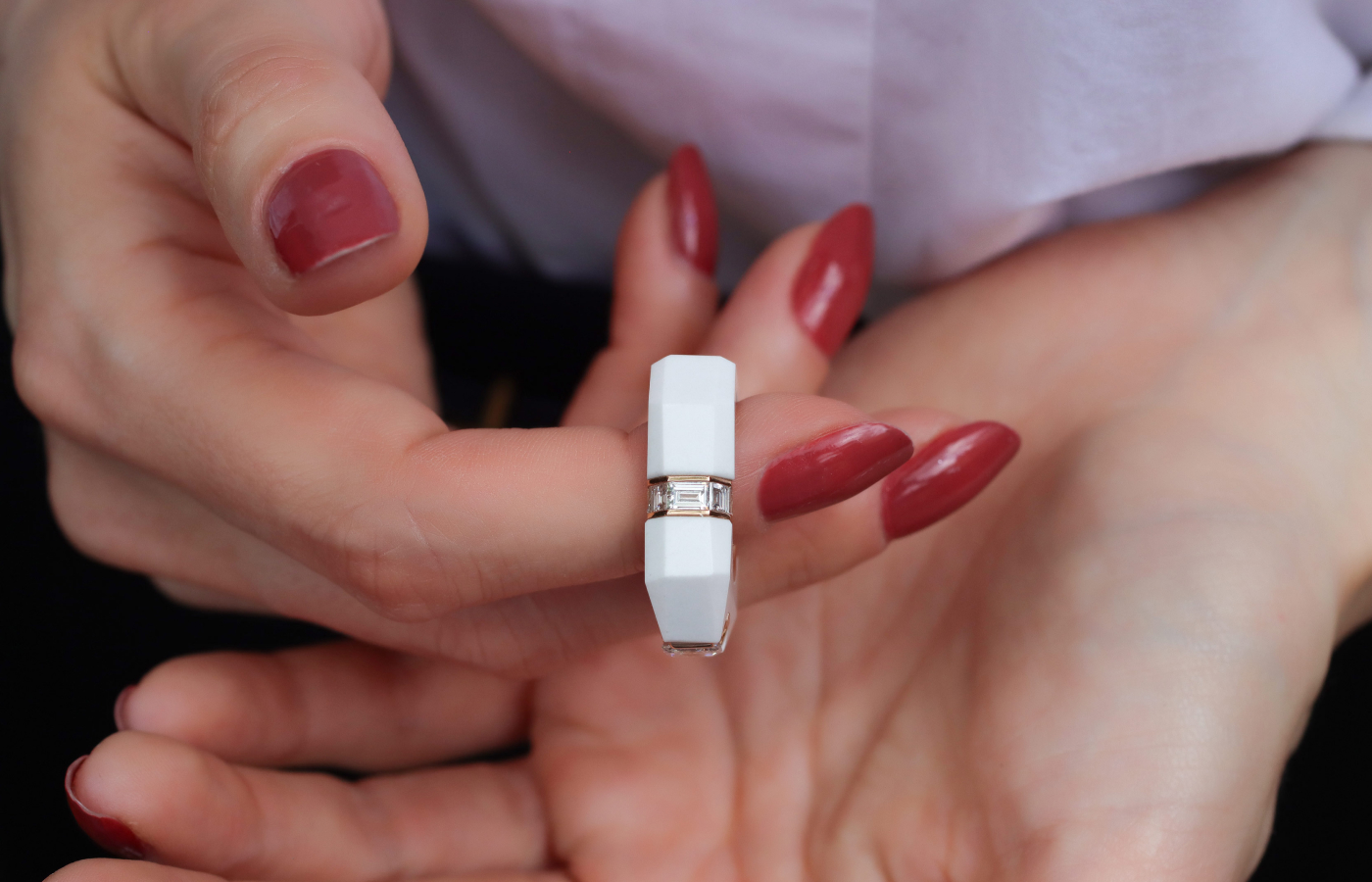  Carre-cut diamond details in a white cacholong ring by Inés Nieto