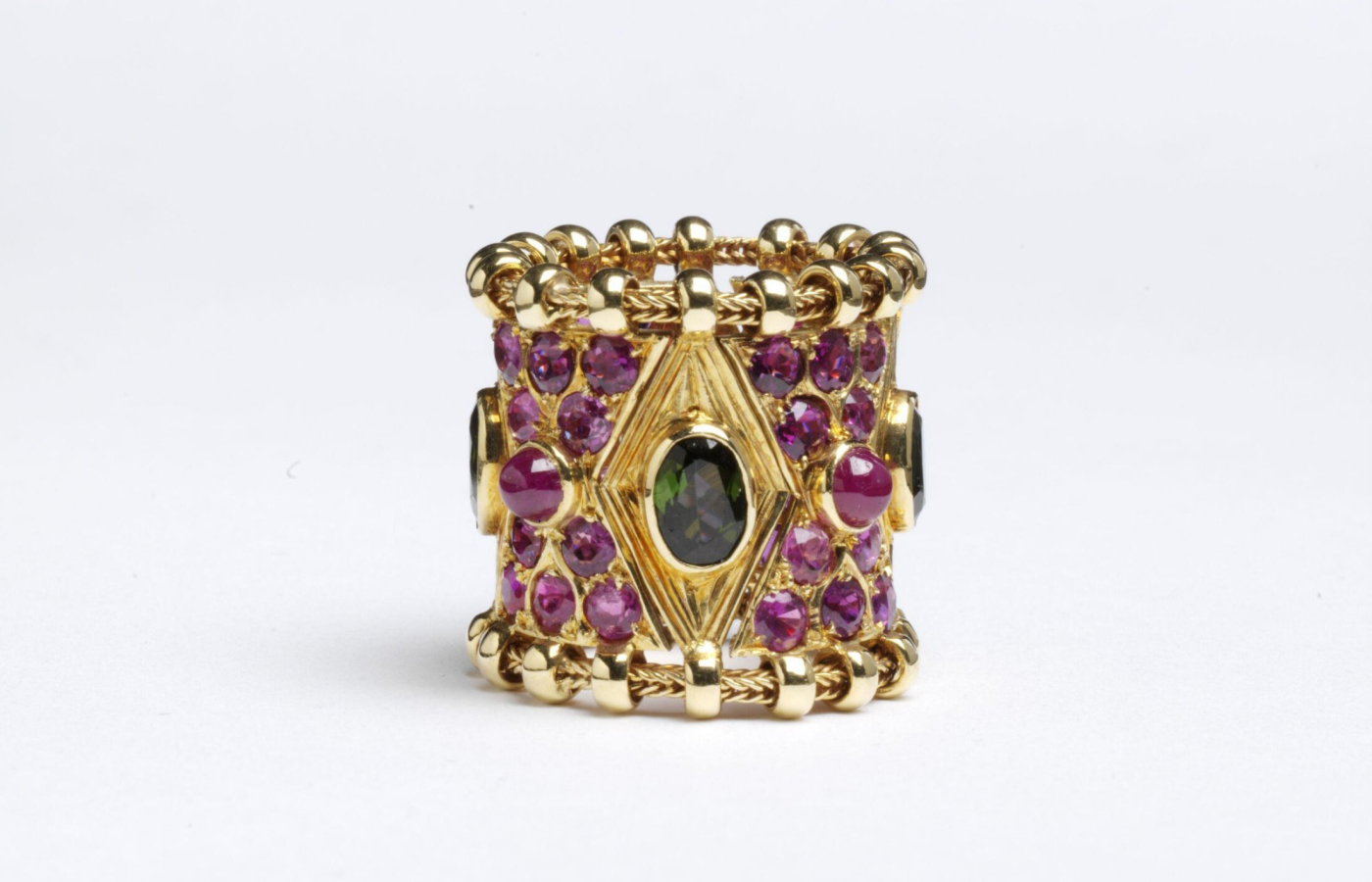  Elizabeth Gage Agincourt ring (1967) with faceted tourmalines and cabochon rubies in 18k yellow gold, from the permanent collection of the Victoria and Albert museum 